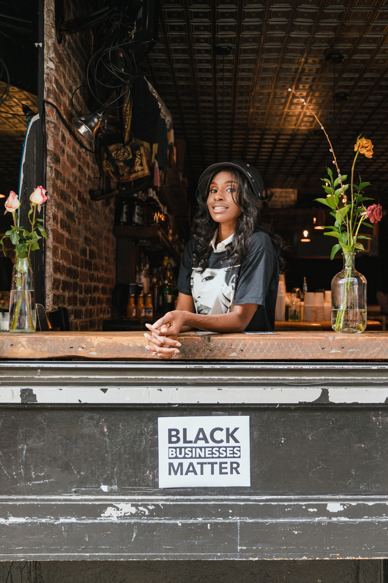 black business owner tends her shop